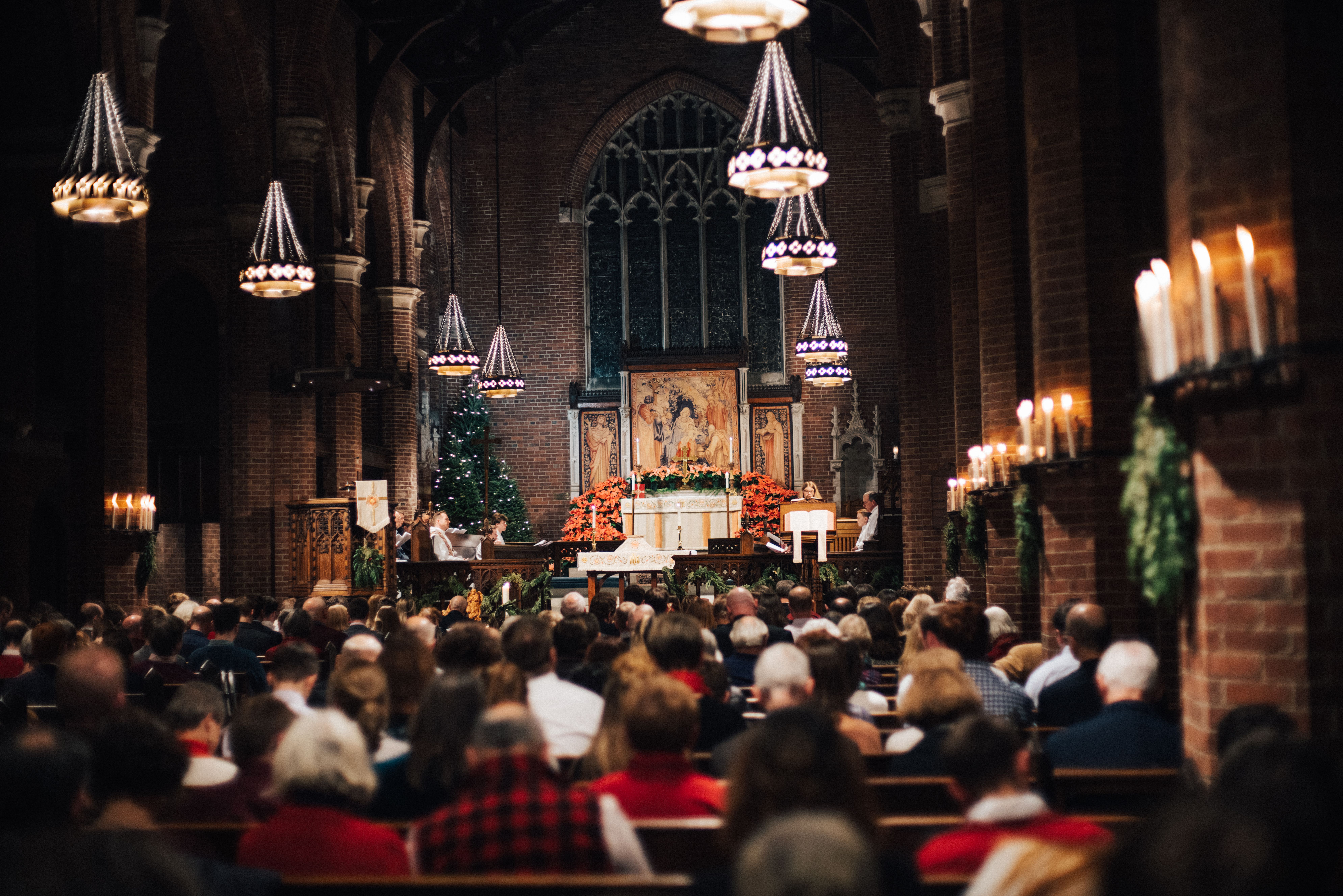 Parish of the Epiphany's sanctuary filled with people at Christmastime