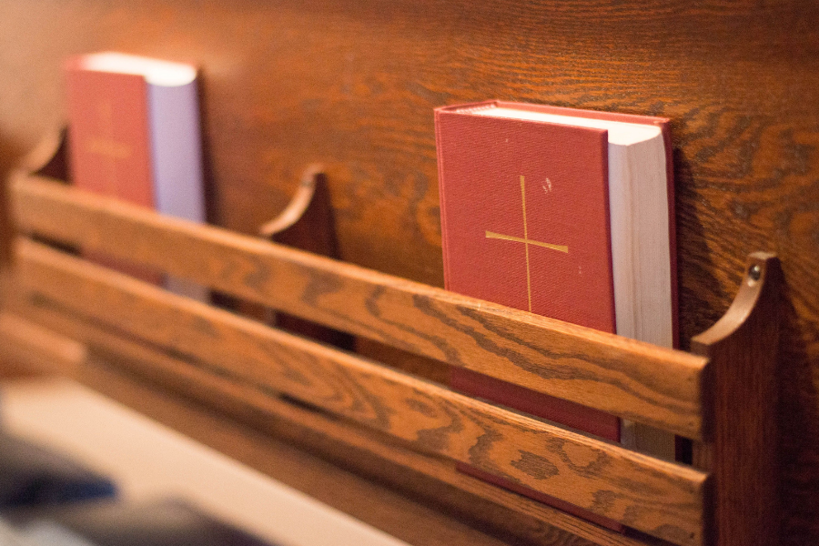 Red Books of Common Prayer in the pews at Parish of the Epiphany