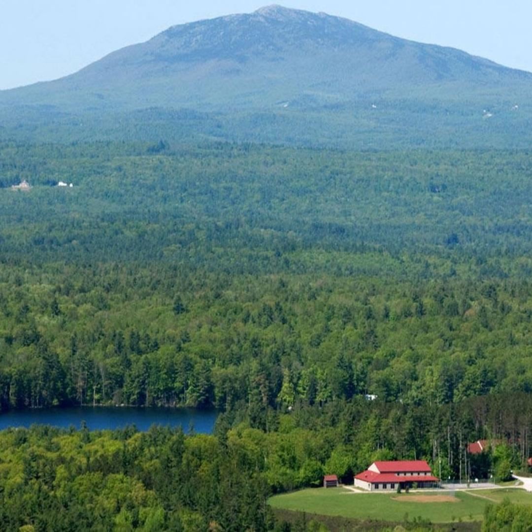 Barbara C. Harris Camp set against the mountains and woods of New Hampshire