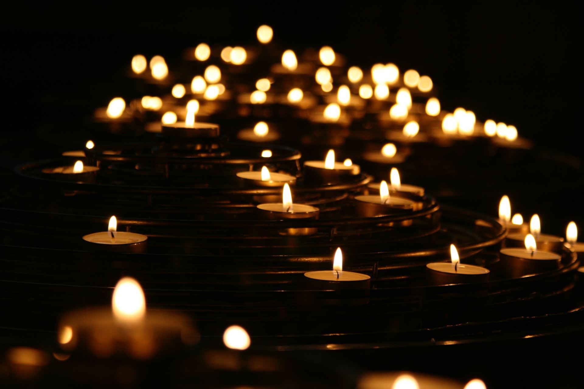 Tealight candles against dark background