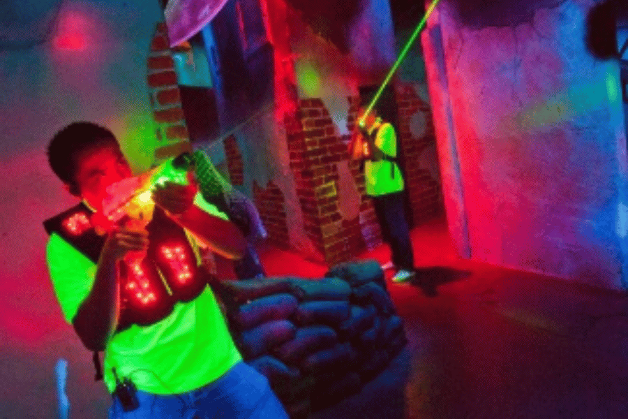 Stock image of two people playing laser tag