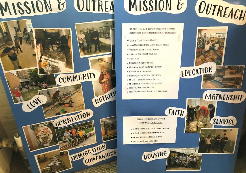 Two blue poster boards with pictures of Mission & Outreach activities at Epiphany