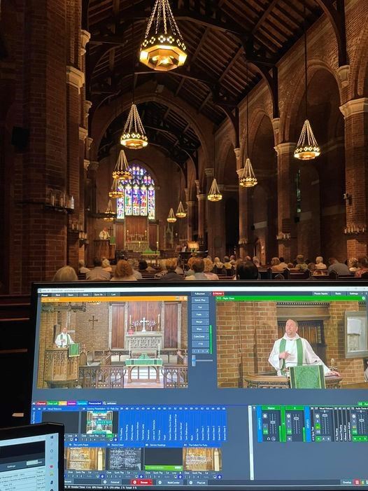 Laptop computer displaying livestream of Parish of the Epiphany's worship service