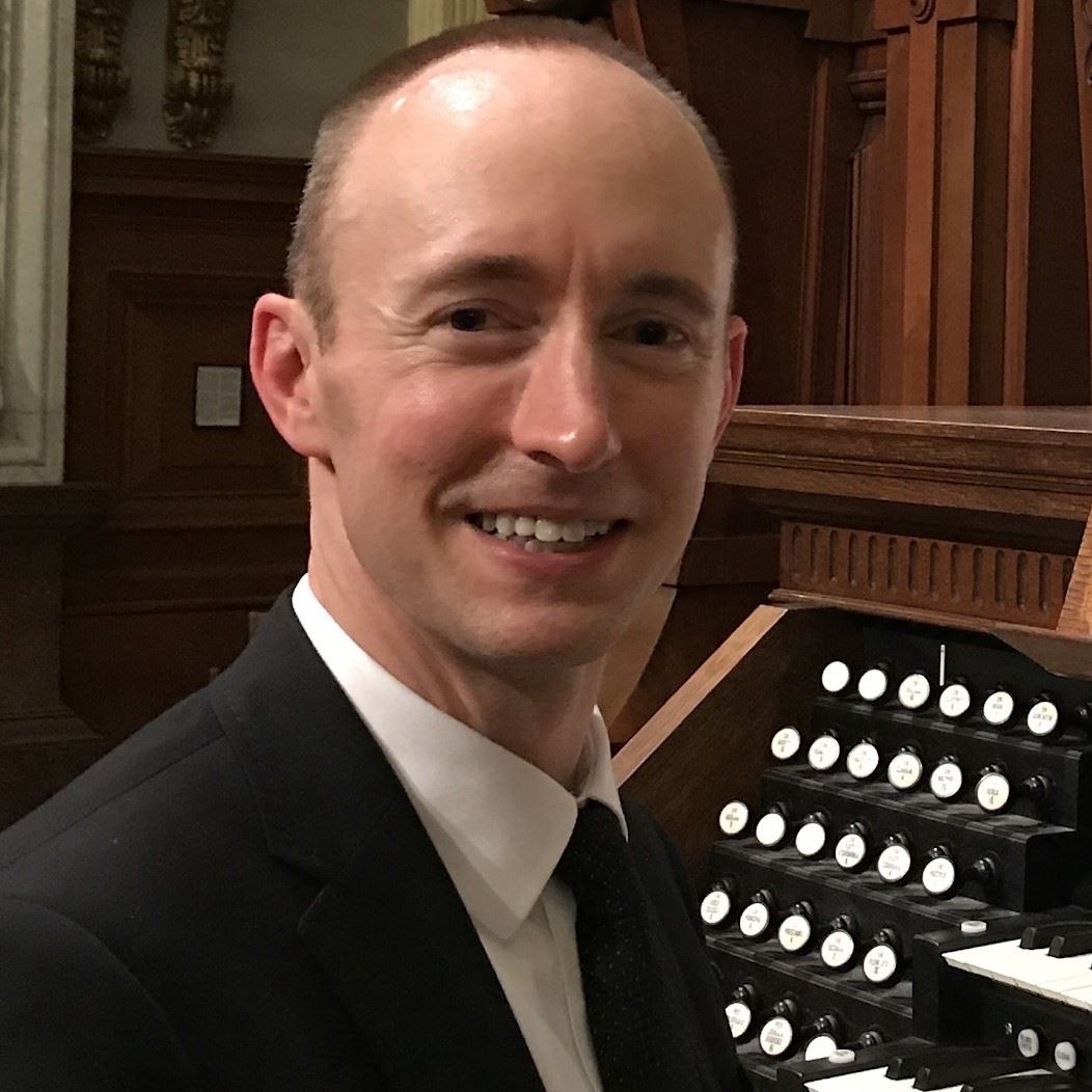 Jeremy Bruns, Interim Director of Music at Parish of the Epiphany, at an organ console
